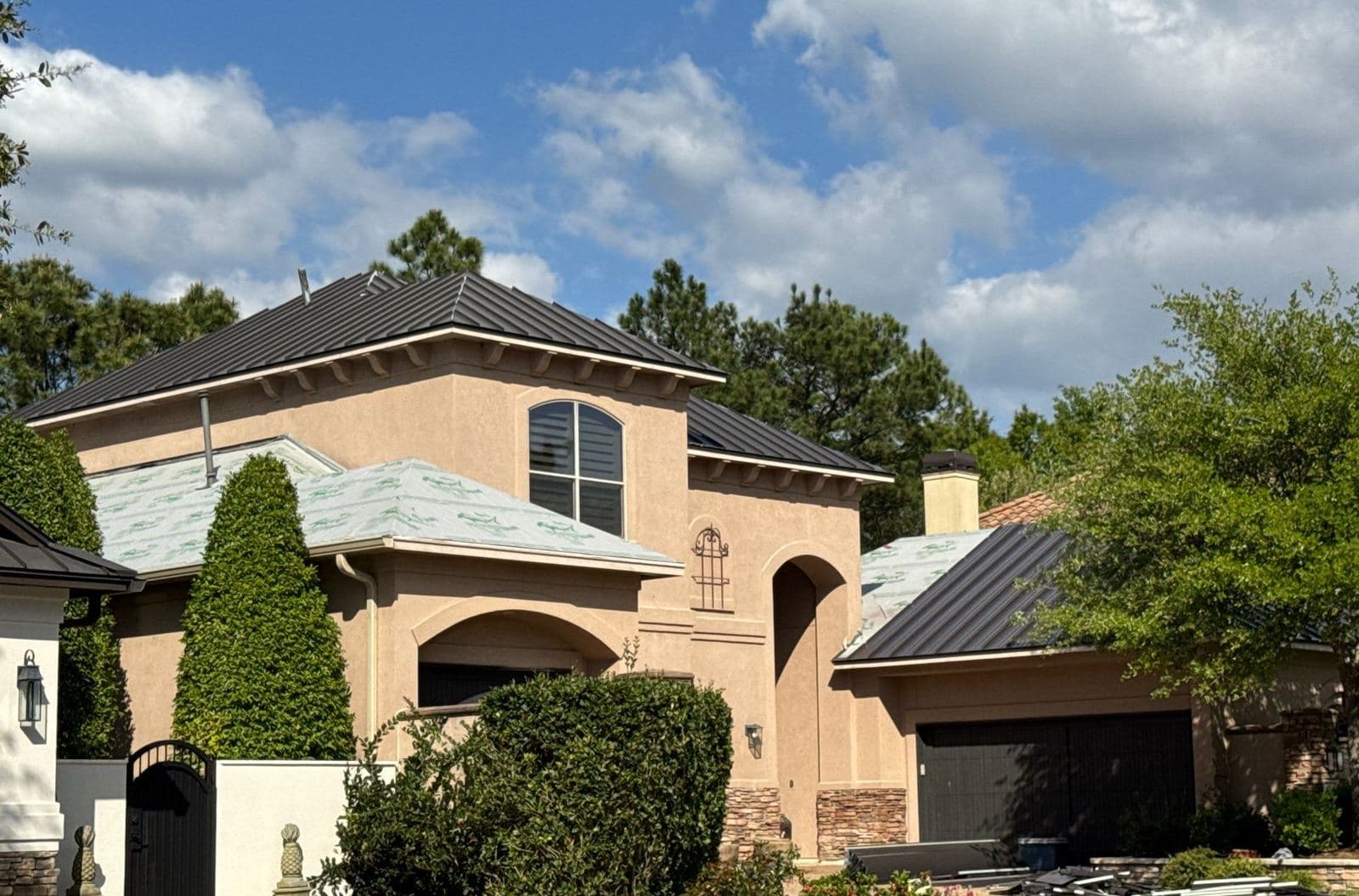 Metal Accent Roofing · Stucco Home