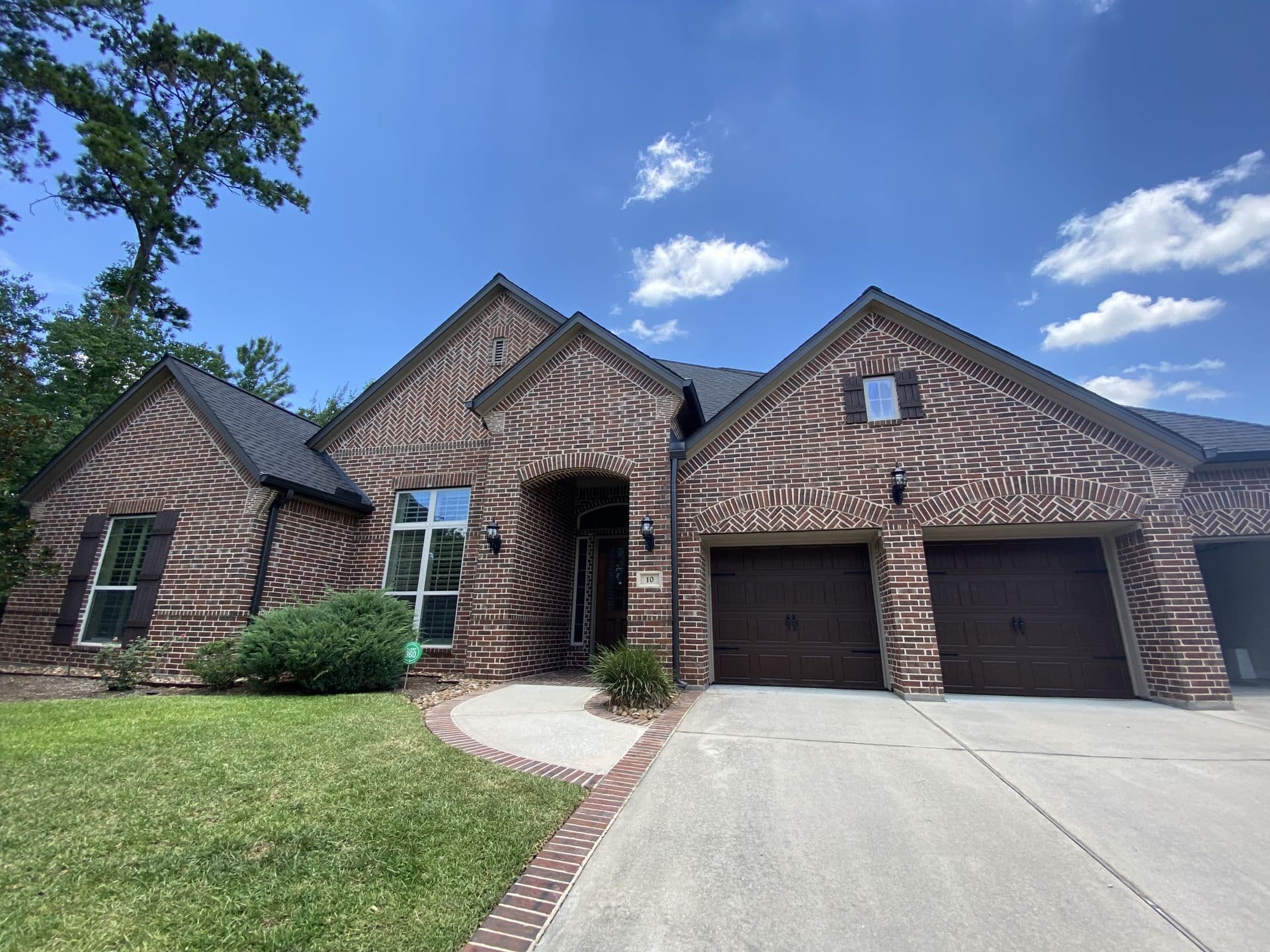 Completed Shingle Roof · Brick Home