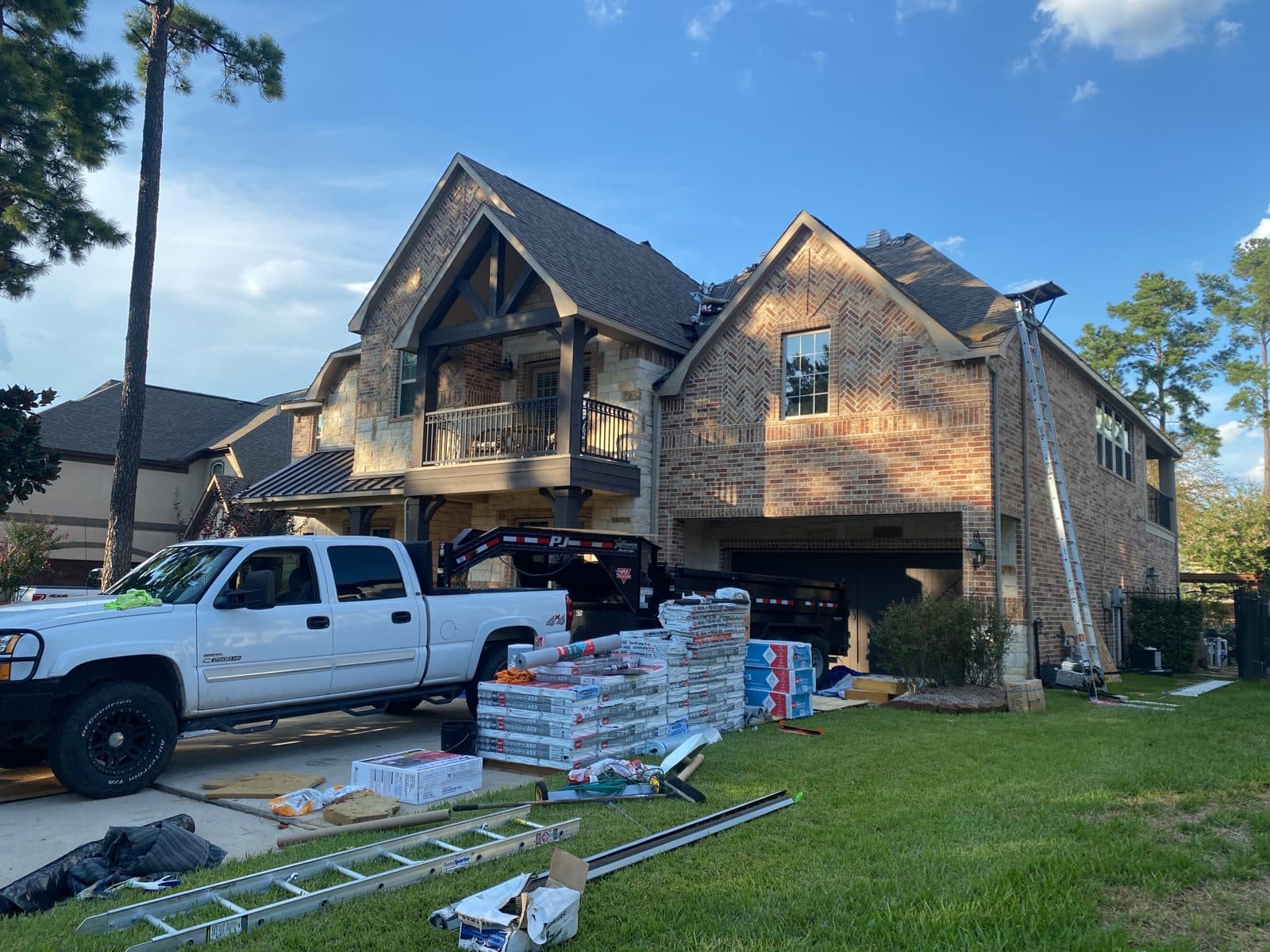 Re-Roof in Progress · Crew & Materials