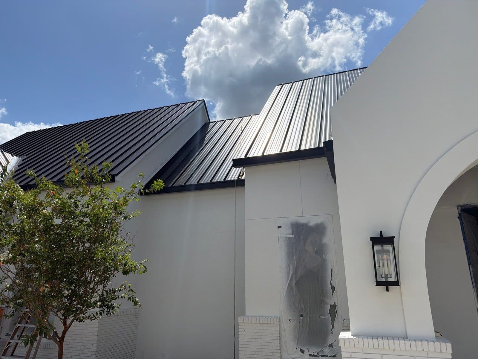 Standing Seam Metal Accents · Stucco Building