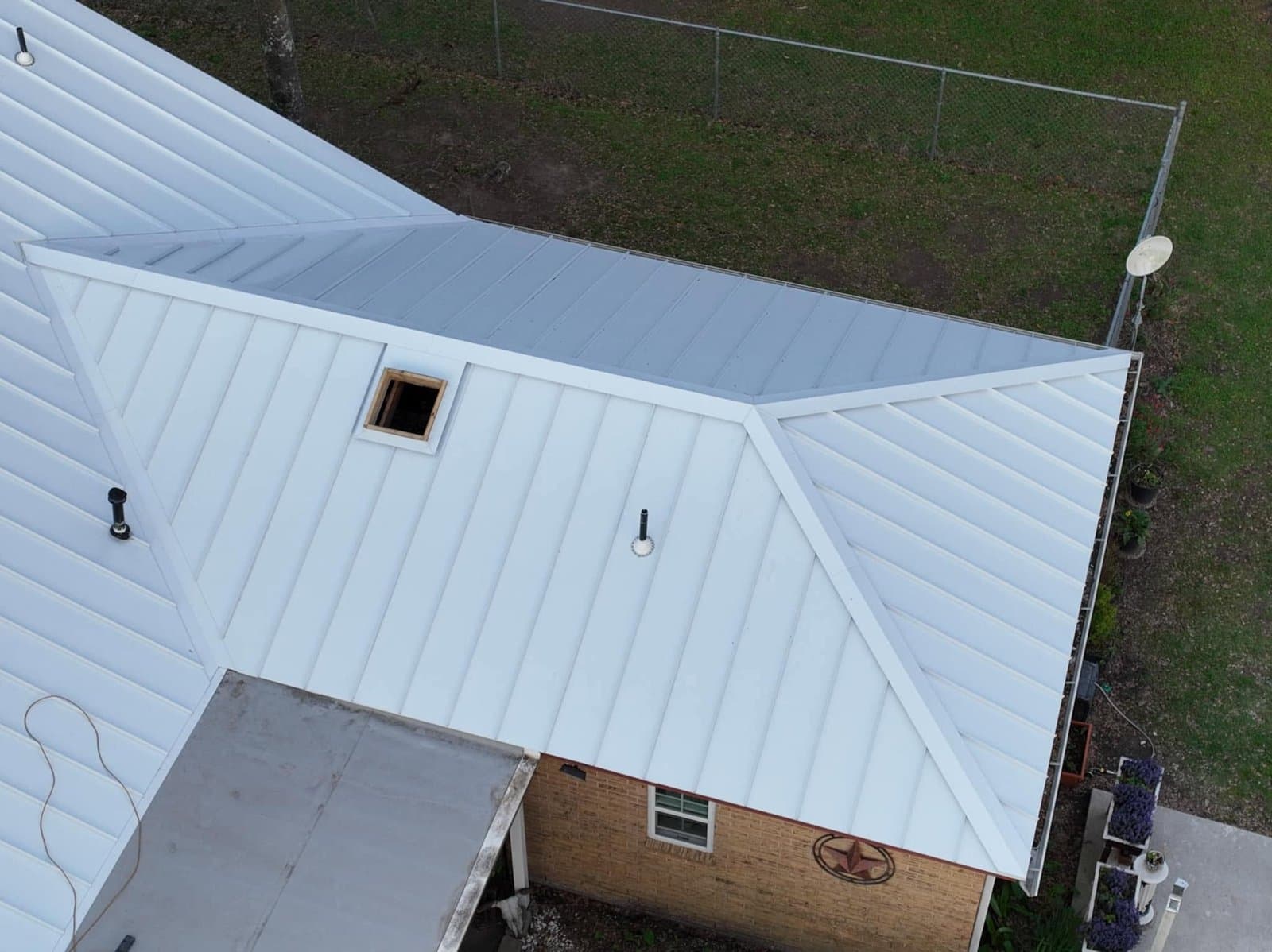 White Standing Seam Hip Roof